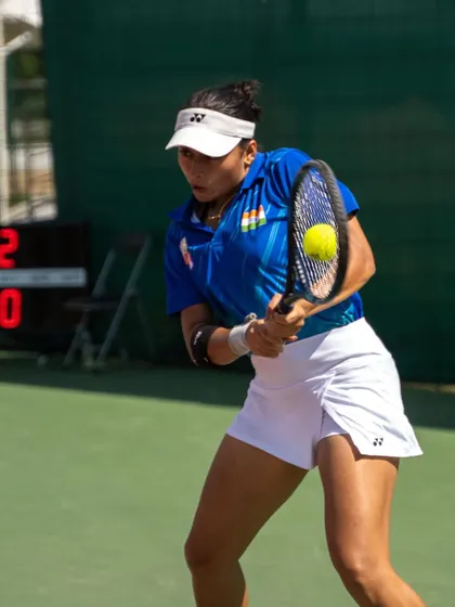 Akanksha in full flight, executing a powerful backhand during the BRICS Games. This action shot highlights the discipline and skill that earned her a bronze medal.