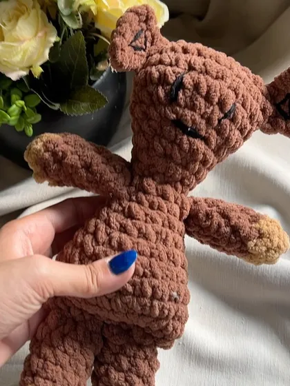 A close-up of our Mr. Bean's Teddy, showing the texture of the chunky yarn. This plushie is designed to be a durable, huggable friend, perfect for bringing a bit of classic comedy and warmth into your home.