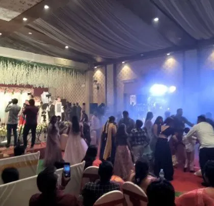 The party gets going with smoke effects and colorful lighting.