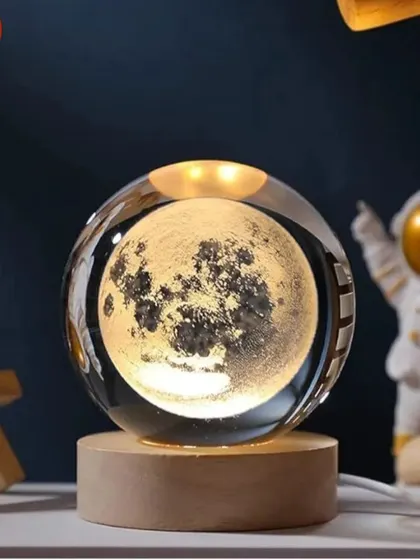 Illuminate your desk with this beautiful crystal ball lamp showing a detailed 3D moon. The warm light creates a calming ambiance, making it a perfect gift.