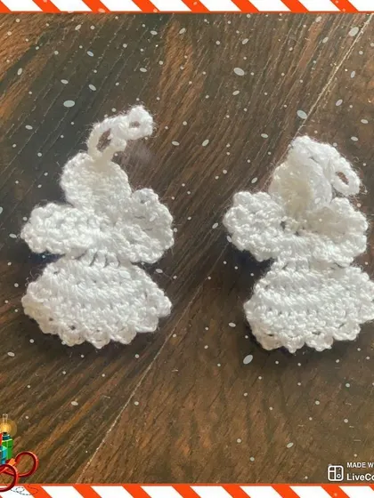 These delicate white angel ornaments add a touch of elegance to any Christmas tree. The simple, classic design is timeless.