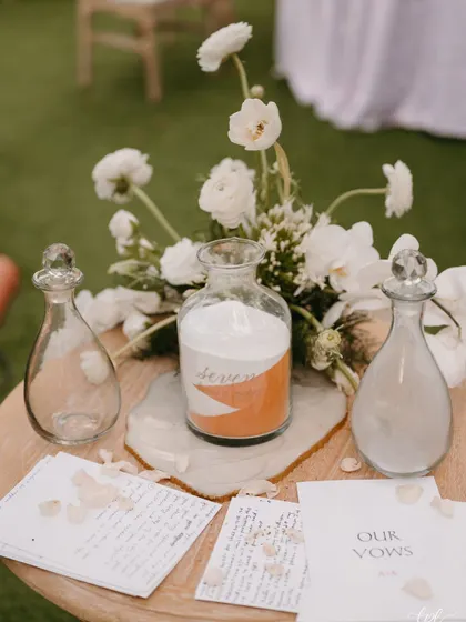 The sand ceremony setup, where the couple poured two different colors of sand into a single jar to symbolize their union.