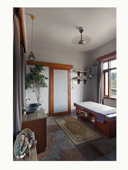 A full view of the serene massage and wellness area within the master bathroom. Natural light, earthy tones, and organic materials come together to create a space dedicated to health and relaxation.