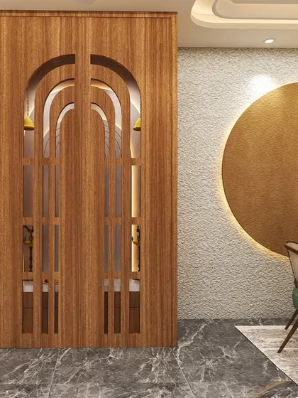 This image shows the pooja room with its custom-designed wooden pocket doors closed. The arched cutouts offer a glimpse of the sacred space within while saving space.