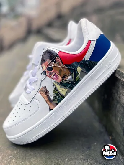 A full side view of the Tom Cruise portrait sneaker, capturing the energy and detail of the hand-painted artwork.
