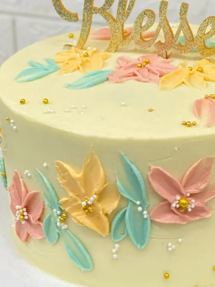 A close-up of the beautiful palette knife flowers on the 60th birthday cake.