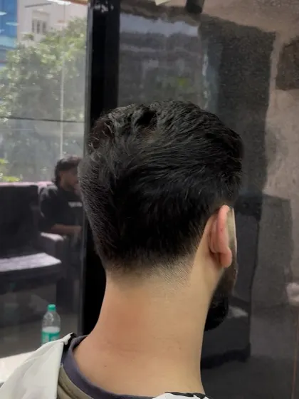 The back of a classic taper haircut, showing the clean neckline.