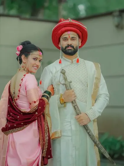A variation of a classic wedding portrait, showing the couple's regal attire and calm connection.