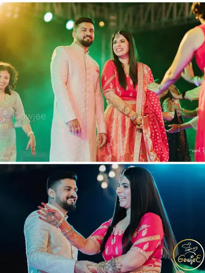 The couple on the dance floor, surrounded by friends and family at their Sangeet.