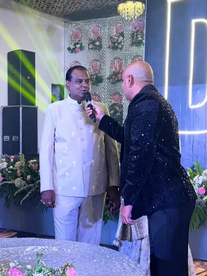 An anchor from my team interacting with a guest on stage. We provide professional anchors who can engage the audience and keep the energy high throughout the event.