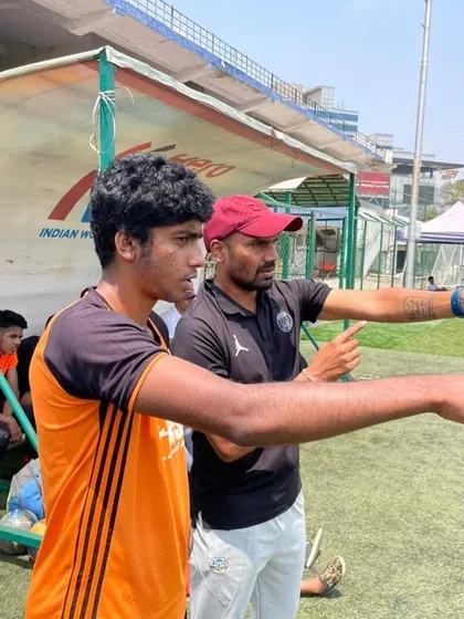 Coach giving directions to Amit Kumar from the sidelines. Tactical instruction is a key part of our elite development program.