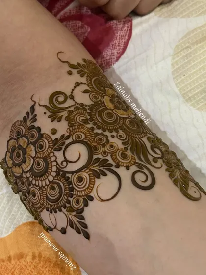 A close-up of the armband portion of this flowing design, showing the beautiful start to the full piece.