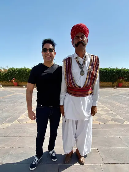 Posing with one of the traditionally dressed guards at Suryagarh, Jaisalmer. It's the local culture and warm hospitality that make Rajasthan weddings so special.