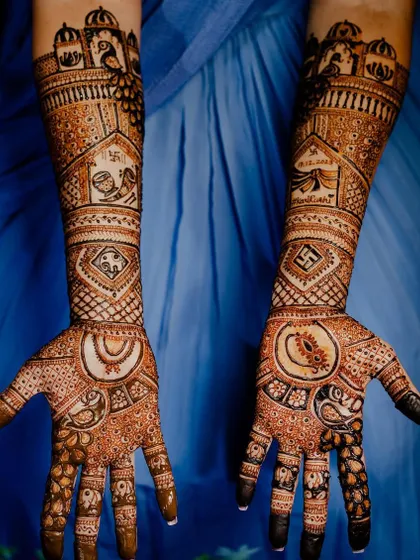 This design features palace architecture with peacocks, along with a wedding procession (baraat) and swastika symbols.