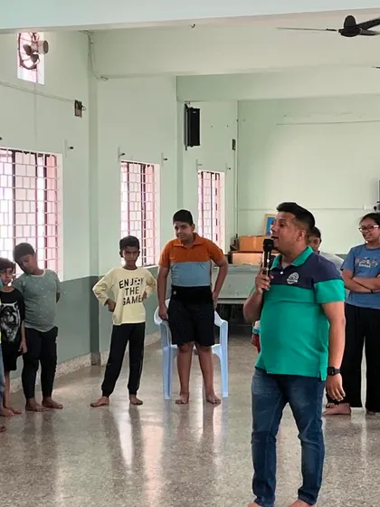 Here I am with a group of students, guiding them through a song. We often break into smaller groups to ensure everyone gets a chance to shine.