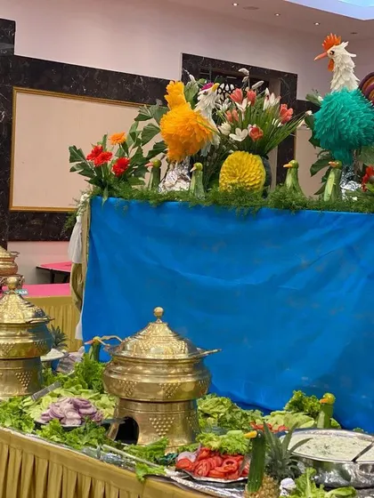 Our buffet presentation is about more than just food; it's about creating a visual feast. Here, we've used intricate vegetable carvings to add a touch of artistry to the salad bar at a wedding reception.