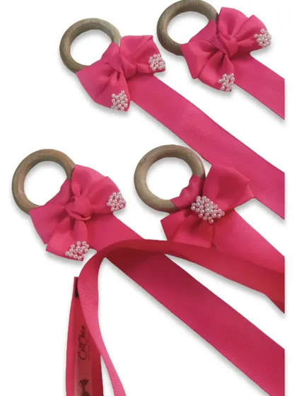 A batch of our pink bow organizers, ready to help keep your hair accessories tidy and accessible.