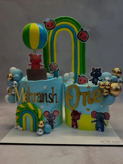 This Cocomelon cake was for a first birthday, designed as two separate cakes that come together to spell "ONE". It's a creative way to celebrate a milestone.