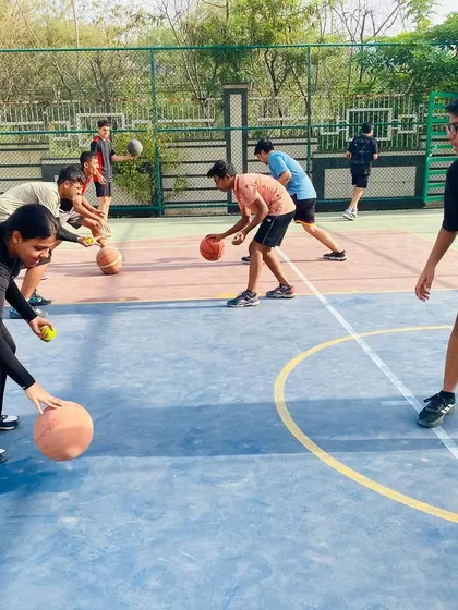 A group of players works on synchronized dribbling drills to improve rhythm and handling.