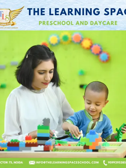 A child and teacher build together in our Lego Space. This interactive area fosters collaboration and problem-solving, guided by our supportive educators.