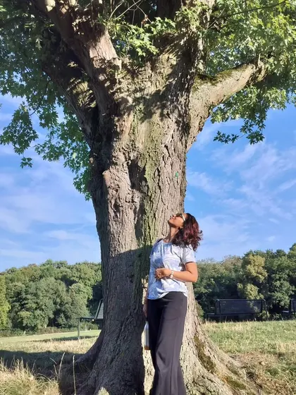 Connecting with the wisdom of an ancient tree in Cologne, Germany. Nature's teachings are universal, and we find our practice wherever we go.