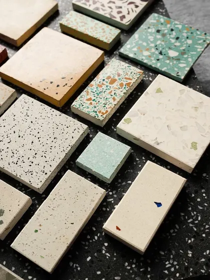 An artful arrangement of various terrazzo samples in different shapes and sizes, showcasing the breadth of our custom capabilities.