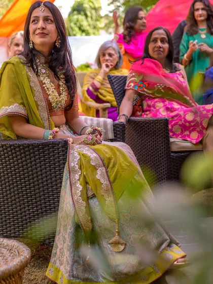 A candid shot of the bride during her intimate Mehendi, listening to the conversations and soaking in the moment.