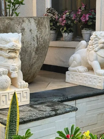 Invite protection and majesty into your home with our sandstone Foo Lion statues. These traditional guardian figures, one male and one female, are placed at entrances to bring positive energy and ward off harm.