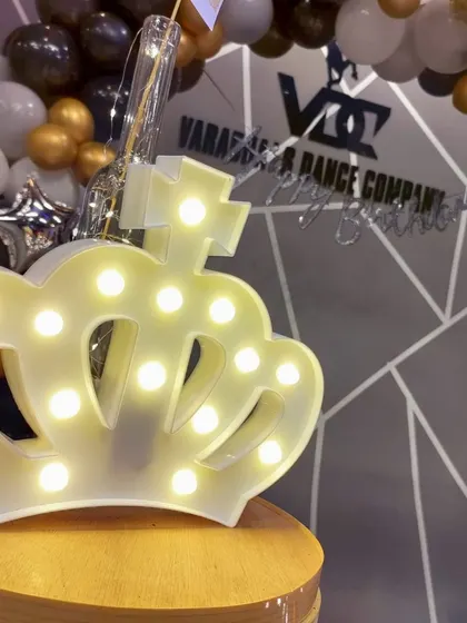 It's all in the details. A lighted crown prop adds a touch of royalty and is a perfect accent piece for a milestone birthday or any grand celebration.