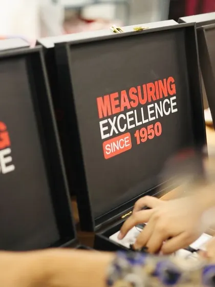 A custom-branded box with the tagline "Measuring Excellence Since 1950." We can create fully customized packaging to reflect your company's history and values.