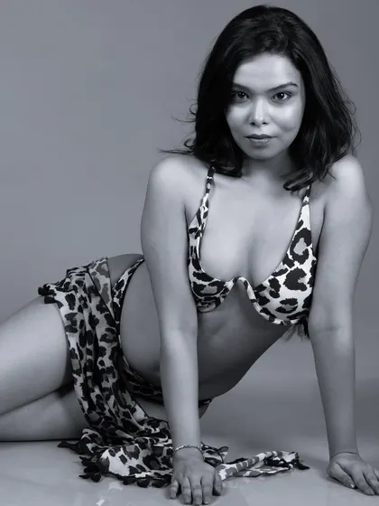 A black and white version of a reclining pose, adding a classic and timeless feel.