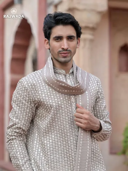 A close-up of the beige printed kurta, highlighting the subtle pattern and the soft fabric. The matching stole adds a touch of sophistication to this comfortable and stylish outfit.
