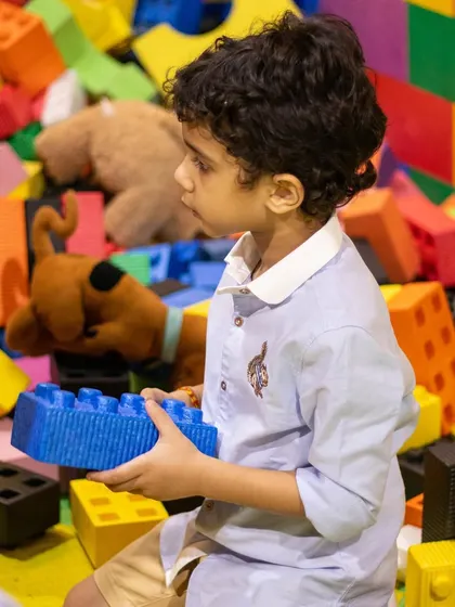 Building new worlds with our colorful, oversized legos. This activity is great for developing fine motor skills and creativity.