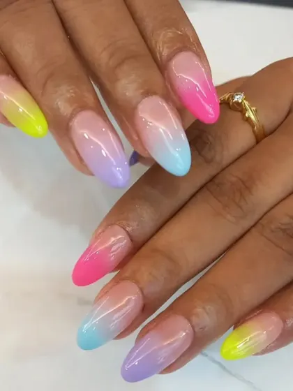 A playful rainbow ombre set, with each nail blending into a different pastel color for a fun and unique look.