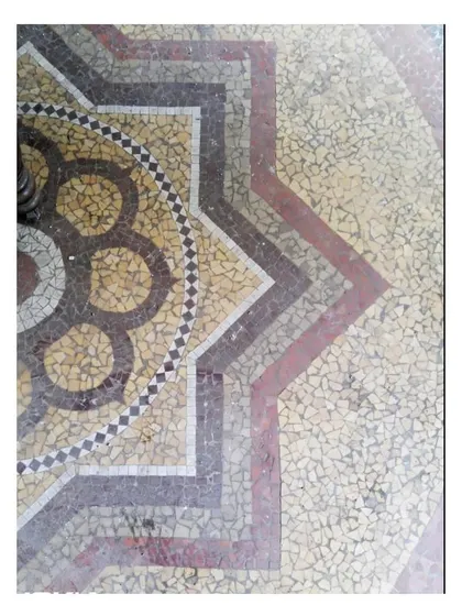 Detail of a star-shaped mosaic pattern, showcasing the rich color palette and geometric precision of the original flooring that we inherited and brought back to life.
