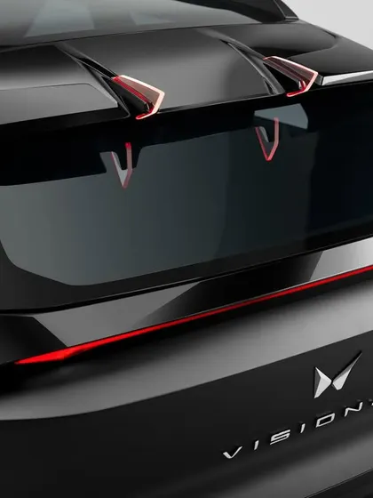 This is a detailed shot of a top-secret concept car for Mahindra. Automotive photography, especially for unreleased models, demands extreme precision in lighting to accentuate every design line while managing reflections on the unique matte finish.