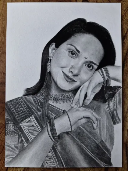 A detailed pencil sketch of a woman in beautiful traditional attire. I enjoy the challenge of drawing intricate details like the fabric of the saree and the design of the jewelry to create an elegant portrait.
