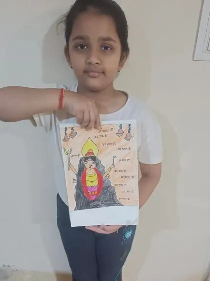 A young student proudly displays her drawing for Ram Navmi. We love celebrating festivals through art, helping children connect with cultural stories in a creative way.