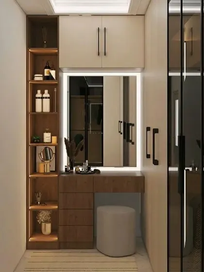 A compact dressing unit with a built-in vanity, a mirror with integrated lighting, and open shelving for easy access to daily essentials. The design is perfect for a walk-in closet or a bedroom corner.