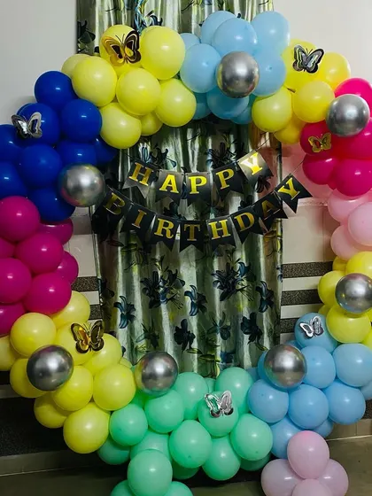 Another shot of the vibrant rainbow butterfly balloon ring.