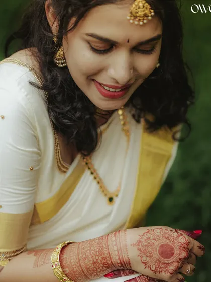 A sweet portrait of the bride looking down, her smile gentle and serene.