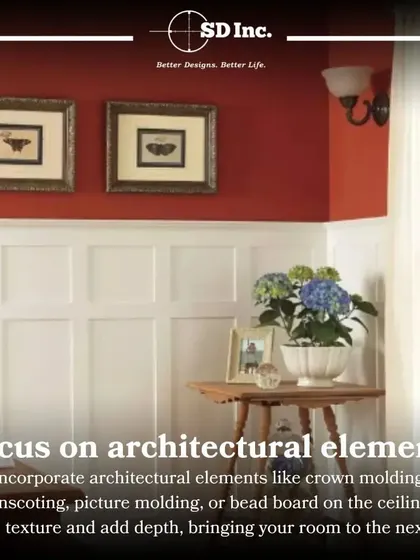 Architectural elements like crown molding and wainscoting are excellent ways to add texture and depth. This image shows how white paneling can elevate a room and create a sense of classic structure.