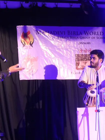 On stage with rapper Armaan Khan bhai during an inter-school fest. This live collaboration shows a fun fusion of tabla beats and rap, demonstrating my versatility in different musical settings.