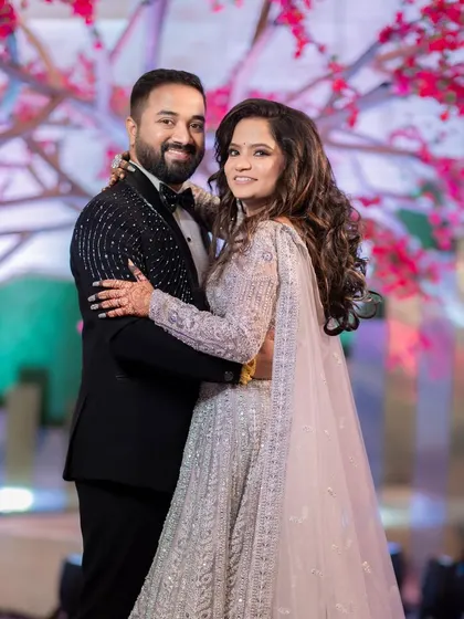 The happy couple, ready to celebrate. The bride's makeup is timeless and beautiful, ensuring these photos will be cherished forever.