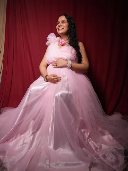 This flowing pink gown creates such a dreamy and ethereal look for a maternity photoshoot.