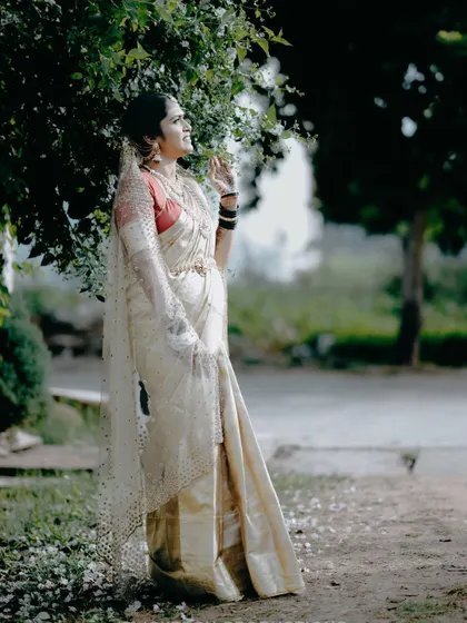 A thoughtful portrait of the bride looking out, her delicate veil catching the light. This shot has a lovely, cinematic quality.