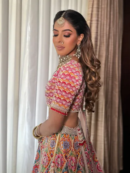 Another beautiful shot of Anjali. The makeup is fresh and vibrant, perfect for a day event.