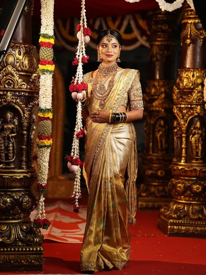 My bride Monisha looking absolutely regal in a golden tissue Kanjivaram saree.