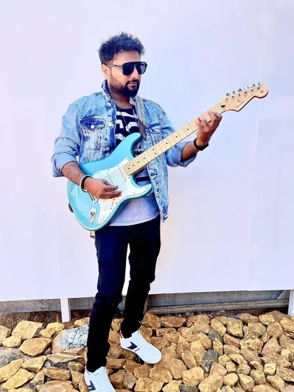 Rocking an electric guitar and a denim jacket for a photoshoot. While I mostly play acoustic, I love the style and sound of an electric guitar too.