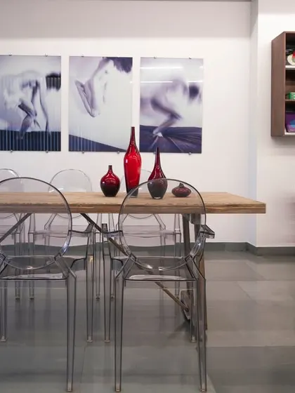 The conference table in the Ecstacy showroom seamlessly merges with the display area, blurring the lines between work and showcase. This project was a rewarding challenge, pushing us to design outside the box.